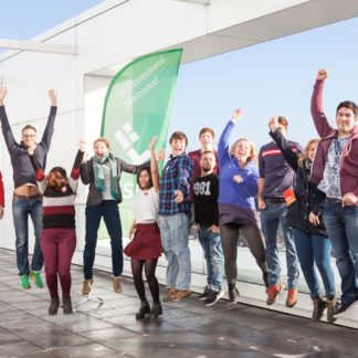 Jumping exchange students of the Hochschule Bremen on a high building