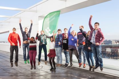 Jumping exchange students of the Hochschule Bremen on a high building